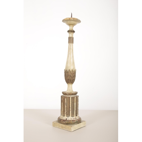 19 - THREE  ITALIAN WHITE-PAINTED AND PARCEL GILT PRICKET CANDLESTICKS

carved and gilded with fluted col... 