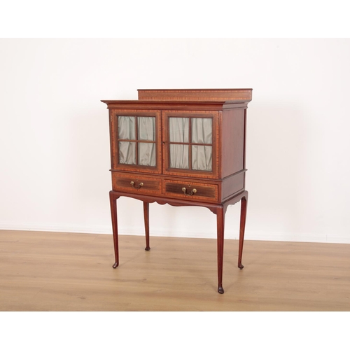 28 - AN EDWARDIAN MAHOGANY AND CROSS-BANDED DISPLAY CABINET

with two glazed doors opening to a shelf wit... 