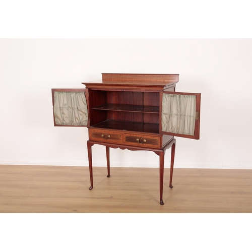 28 - AN EDWARDIAN MAHOGANY AND CROSS-BANDED DISPLAY CABINET

with two glazed doors opening to a shelf wit... 