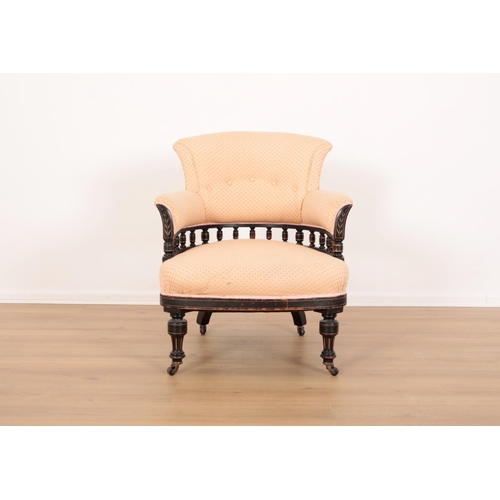 5 - A LATE VICTORIAN EBONISED AND PARCEL GILT ARMCHAIR OF AESTHETIC DESIGN

upholstered in patterned cre... 