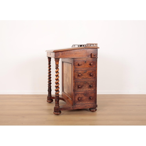 7 - A VICTORIAN WALNUT DAVENPORT

with pierced gallery and tooled leather writing slope enclosing a fitt... 