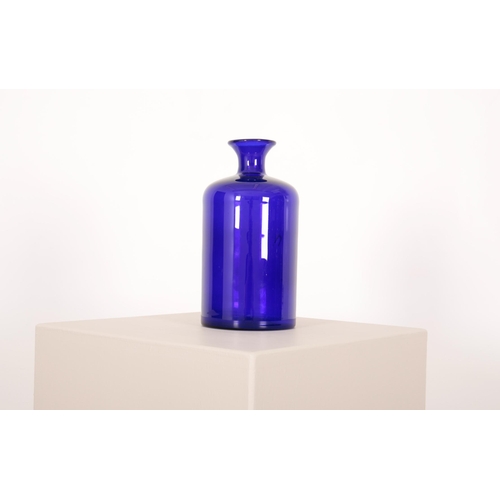 8 - A MOULDED BLUE GLASS MANNEQUIN HEAD

29cm high, a blue glass bottle shaped vase, 26cm high, and a Sp... 