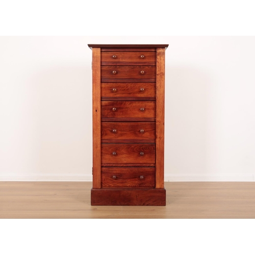 104 - A MAHOGANY AND STAINED PINE WELLINGTON CHEST

fitted with seven drawers enclosed by lockable stile, ... 