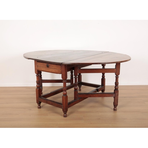 117 - AN OAK DROP-LEAF TABLE

early 18th century, with an oval top over a single frieze drawer, on turned ... 