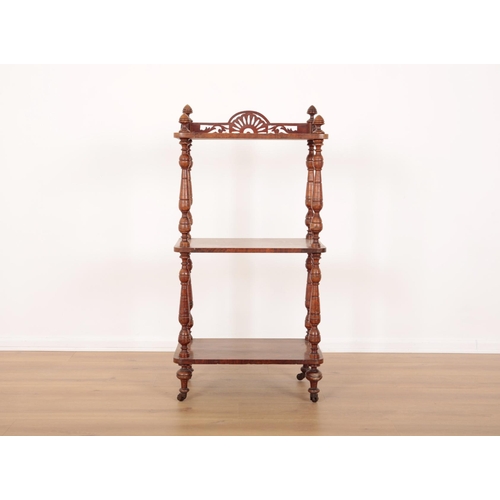 120 - A VICTORIAN WALNUT THREE-TIER WHATNOT

with acorn finials to the corners and pierced gallery, turned... 