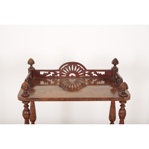 120 - A VICTORIAN WALNUT THREE-TIER WHATNOT

with acorn finials to the corners and pierced gallery, turned... 