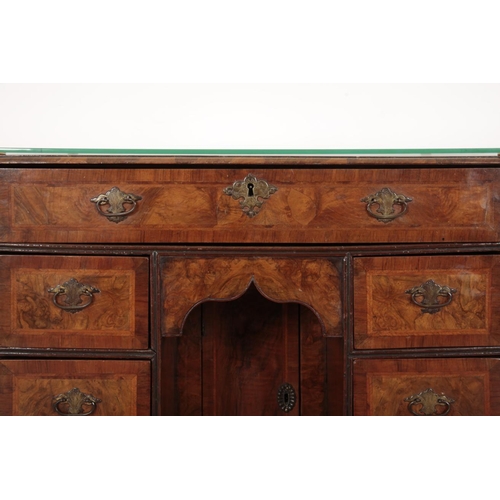 126 - A GEORGE IIII FIGURED WALNUT KNEEHOLE DESK

with feather and cross banding, with an arrangement of s... 