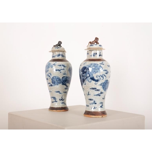 127 - A PAIR OF CHINESE BLUE AND WHITE CRACKLEWARE PORCELAIN VASES

early 20th Century, decorated with kyl... 