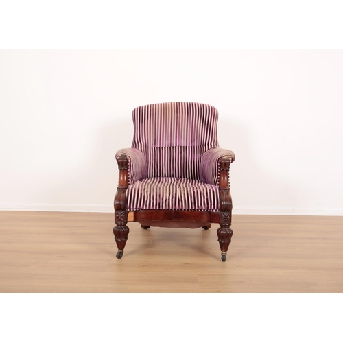 145 - A VICTORIAN MAHOGANY ARMCHAIR

with cut velvet covers, the spoon back above wide-spread arms, one mo... 