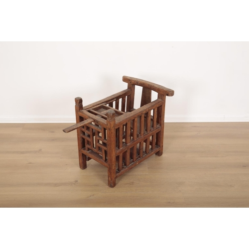 151 - A CHINESE HARDWOOD BABY CHAIR

late 19th/20th century, with inbuilt seat and sliding 'tray', 55cm hi... 