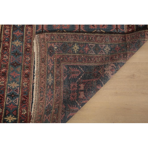 158 - AN ANTIQUE NORTH WEST PERSIAN RUNNER

the blue ground decorated with repeating stylised flora, 415cm... 