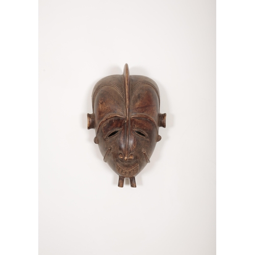 165 - A COLLECTION OF TRIBAL ART

including an iron Mangbetu sickle knife (trumbash), 39cm long, a Dayak w... 