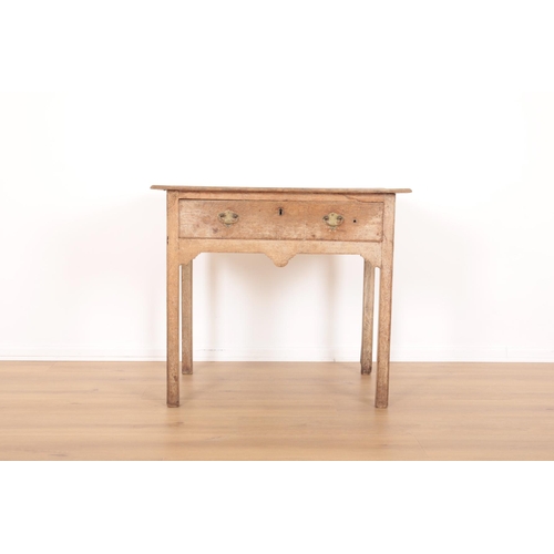 175 - A GEORGE III LIMED OAK SIDE TABLE

the single frieze drawer above a shaped apron, on chamfered block... 