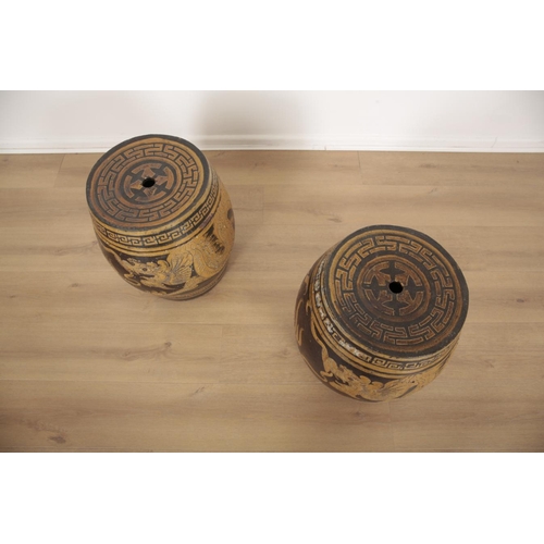 177 - A PAIR OF CHINESE EARTHENWARE BARREL STOOLS

20th century, each decorated with dragons chasing pearl... 