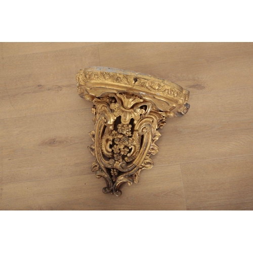 186 - TWO GILTWOOD WALL BRACKETS

19th century, decorated with a profusion of rococo scrolling and floral ... 