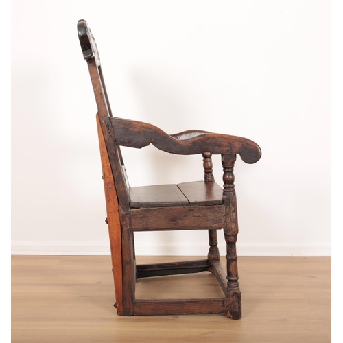 209 - AN OAK WAINSCOT CHAIR

17th century and later, Westmoreland, with carved cresting rail over a panell... 