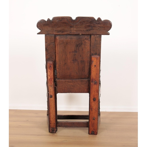 209 - AN OAK WAINSCOT CHAIR

17th century and later, Westmoreland, with carved cresting rail over a panell... 