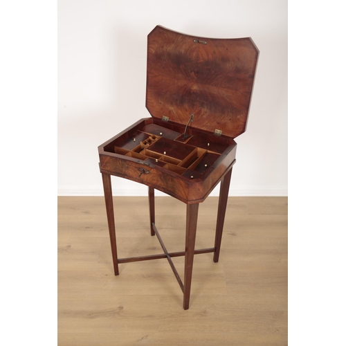 220 - AN EDWARDIAN MAHOGANY SEWING TABLE

the hinged lid opening to a fitted interior, on tapered block le... 