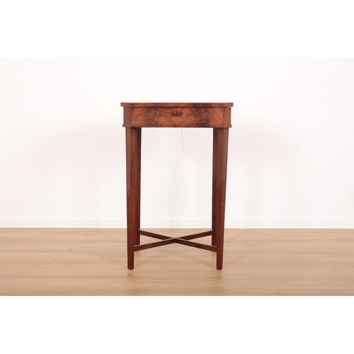 220 - AN EDWARDIAN MAHOGANY SEWING TABLE

the hinged lid opening to a fitted interior, on tapered block le... 