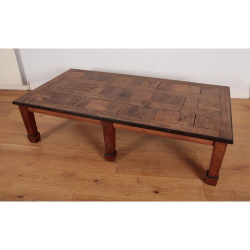 230 - A LARGE PARQUETRY COFFEE TABLE

20th century, the rectangular top with contrasting edges, on tapered... 