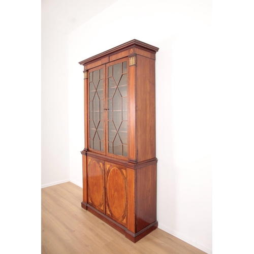 250 - A GEORGE III MAHOGANY AND SATINWOOD LIBRARY BOOKCASE

in the manner of Thomas Sheraton, the upper se... 