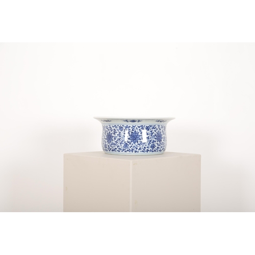 256 - A CHINESE BLUE AND WHITE BASIN

with heaped and piled decoration of scrolling lotus beneath an evert... 