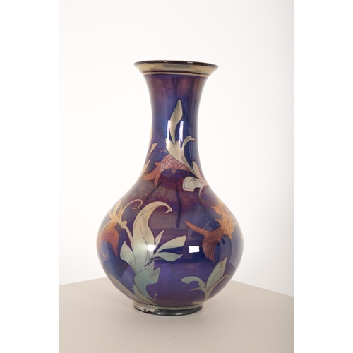 260 - *JONATHAN CHISWELL JONES (b. 1944) FOR JCJ POTTERY: A REDUCTION FIRED LUSTRE VASE

of compressed bal... 