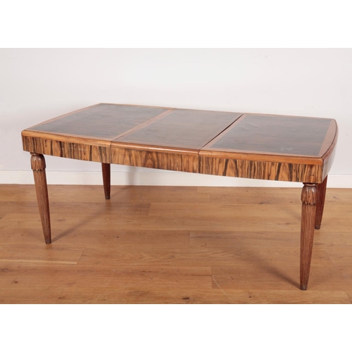 280 - AN ART DECO COROMANDEL AND MAHOGANY EXTENDING DINING TABLE

on reeded and carved legs, 76cm high x 1... 