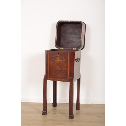 283 - AN EDWARDIAN MAHOGANY AND MARQUETRY INLAID CELLARETTE

the canted top inlaid with a patera, two hand... 