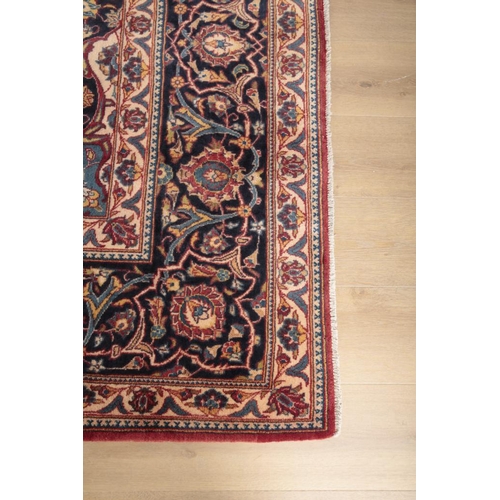 285 - A CENTRAL PERSIAN KASHAN CARPET

the central floral medallion against a brick red ground with blue s... 