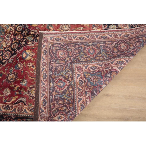 285 - A CENTRAL PERSIAN KASHAN CARPET

the central floral medallion against a brick red ground with blue s... 