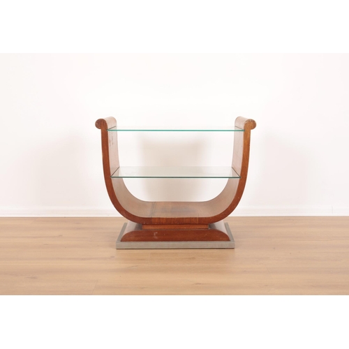 31 - A MID CENTURY TEAK OCCASIONAL TABLE

with two glass shelves, on a contrasting silver coloured pedest... 