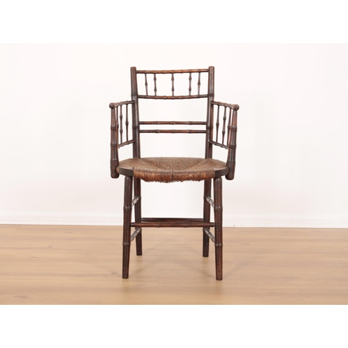 38 - A STAINED BEECHWOOD SUSSEX CHAIR ATTRIBUTABLE TO FORD MADDOX BROWN

19th century, of bamboo design w... 