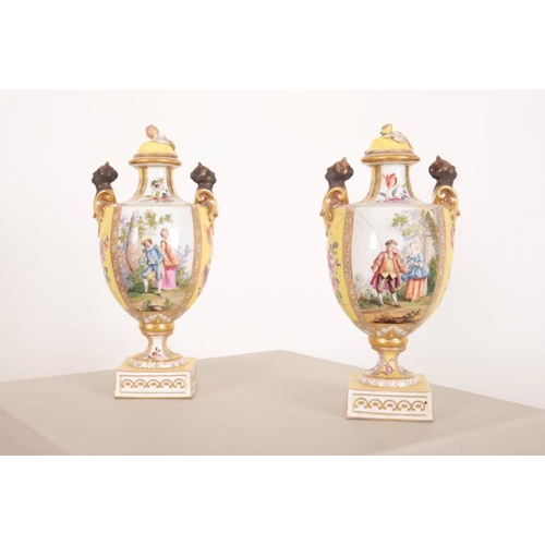 46 - A PAIR OF 'HELENA WOLFSOHN' STYLE PORCELAIN TWO HANDLED URNS

late 19th century, the covers with bud... 