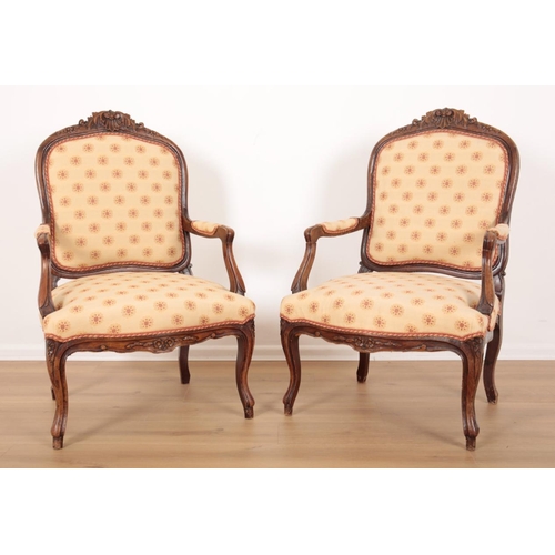 62 - A PAIR OF LOUIS XV STYLE BEECHWOOD FAUTEILS

19th century, the shell and foliate carved cresting rai... 