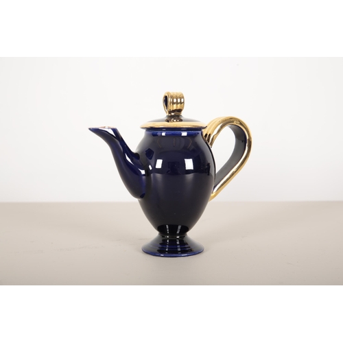 70 - A VALLAURIS DARK BLUE AND GILT TEA SERVICE

1950's, with pink interior, consisting of eight cups and... 