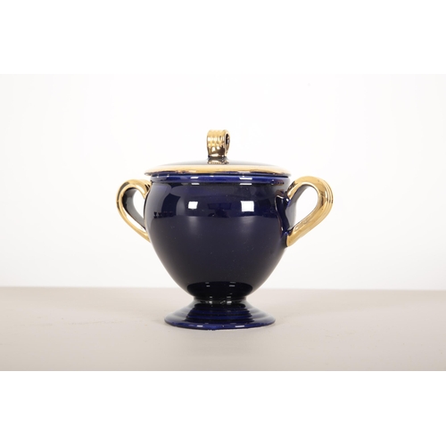 70 - A VALLAURIS DARK BLUE AND GILT TEA SERVICE

1950's, with pink interior, consisting of eight cups and... 