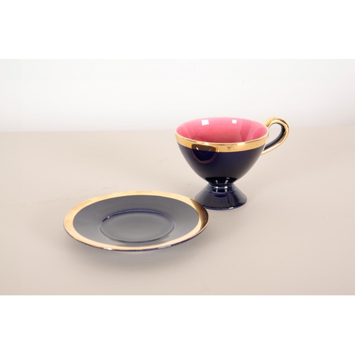 70 - A VALLAURIS DARK BLUE AND GILT TEA SERVICE

1950's, with pink interior, consisting of eight cups and... 