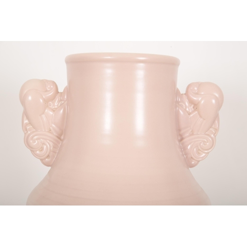 82 - A POOLE POTTERY 'PASTEL PINK' TWIN HANDLED VASE

20th century, marked to the base, 38cm high