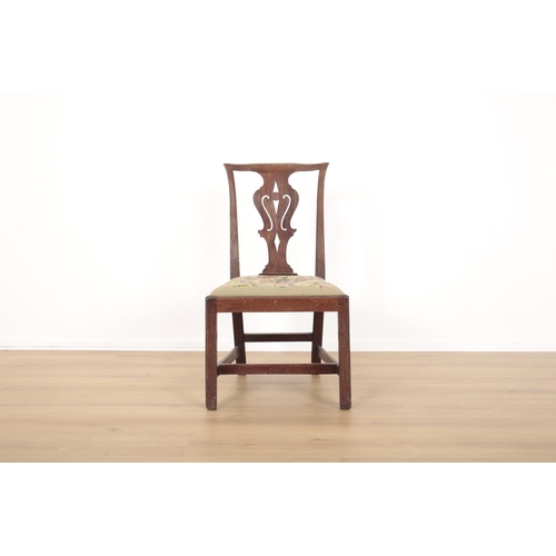 83 - A PAIR OF MAHOGANY 'CHIPPENDALE' HALL CHAIRS

18th century, the shaped cresting rails over pierced v... 