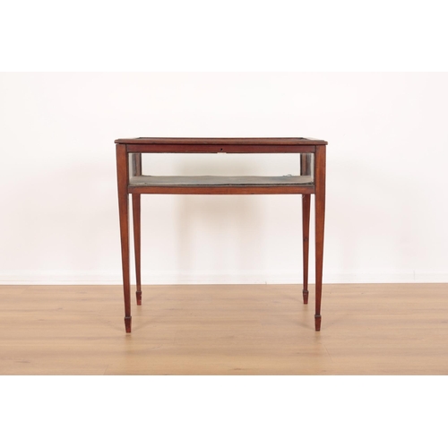 99 - AN EDWARDIAN MAHOGANY BIJOUTERIE

with glazed top and sides and hinged lid, on tapered block legs to... 