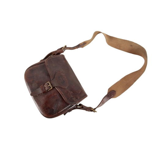 225 - A BROWN LEATHER CARTRIDGE BAG

with a canvas and leather shoulder strap, for approx. 100 cartridges