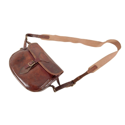 230 - A STERLING BROWN LEATHER CARTRIDGE BAG

with a leather and canvas shoulder strap, for approx. 75 car... 