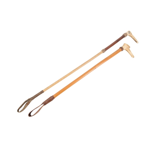 260 - TWO RIDING CROPS

one by T & C Griffith of London, with antler top and a leather and malacca shaft, ... 