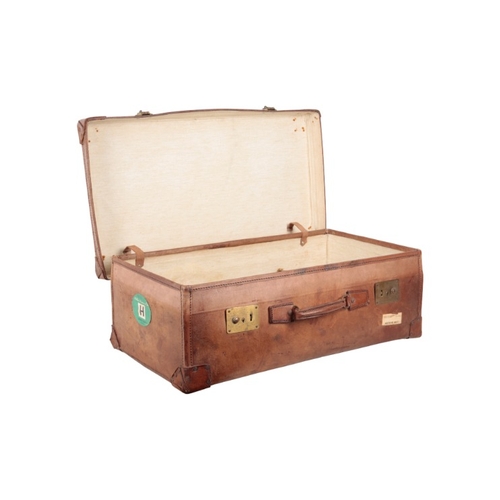 338 - AN EDWARDIAN BROWN LEATHER SUITCASE

with brass locks, leather carrying handles and brass studded co... 