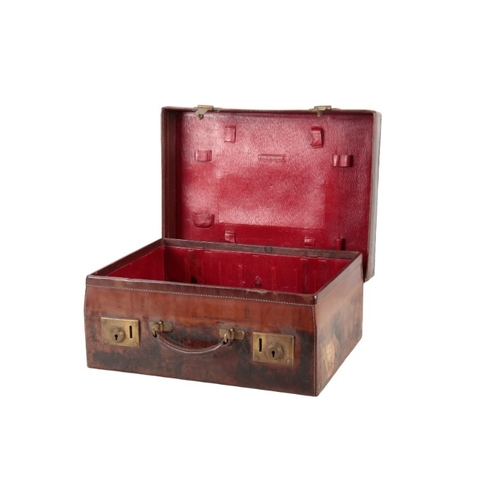 340 - AN EDWARDIAN BROWN LEATHER VANTITY CASE

with red leather interior and brass locks; and a dark blue ... 