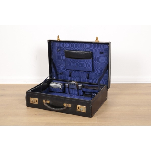 341 - AN EDWARDIAN BLACK LEATHER VANITY CASE

with blue silk lining and part silver-plated fittings, inclu... 