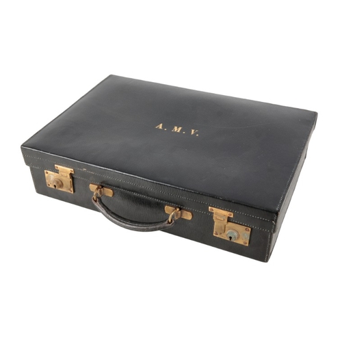 341 - AN EDWARDIAN BLACK LEATHER VANITY CASE

with blue silk lining and part silver-plated fittings, inclu... 