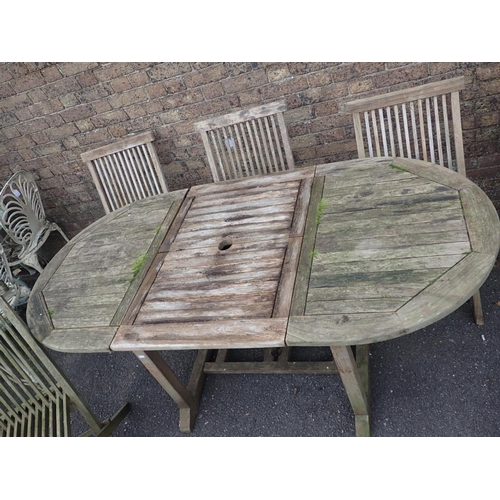 2 - A WEATHERED TEAK EXTENDING GARDEN TABLE AND SIX CHAIRS (folding) the table 181 x 90cm (open) (table ... 