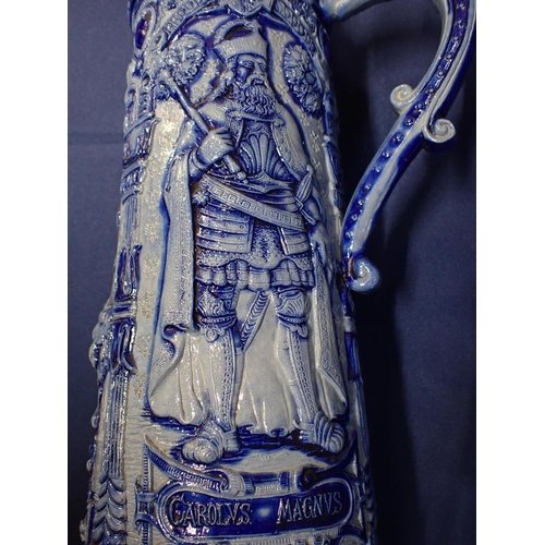 27 - A LARGE GERMAN STONEWARE STEIN moulded in relief with Pipino, Carolus Magnus and Carolus Martellus, ... 